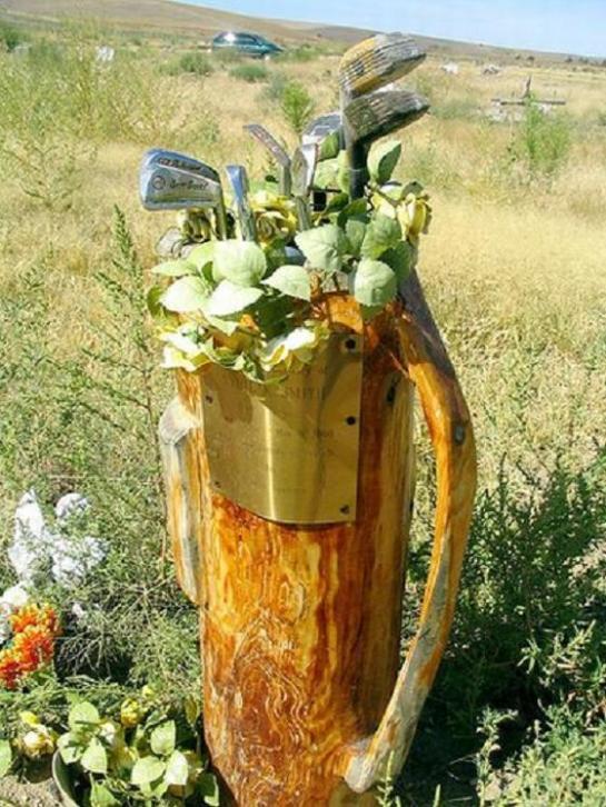 Golf Bag Memorial with flowers and old clubs